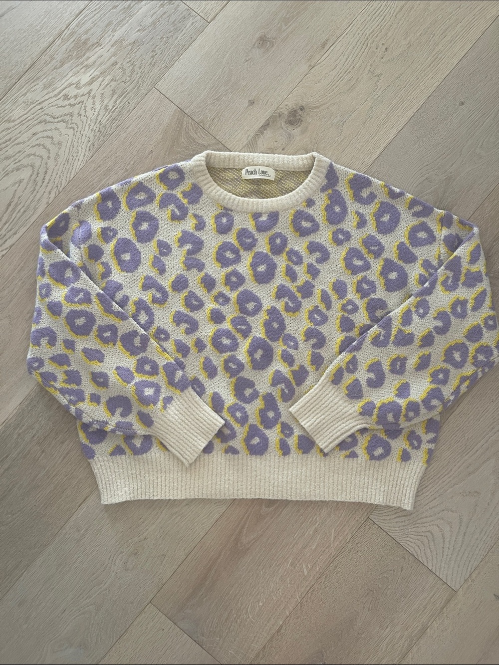 Peach Love California Cream Crewneck Sweater with Purple & Yellow Animal Print